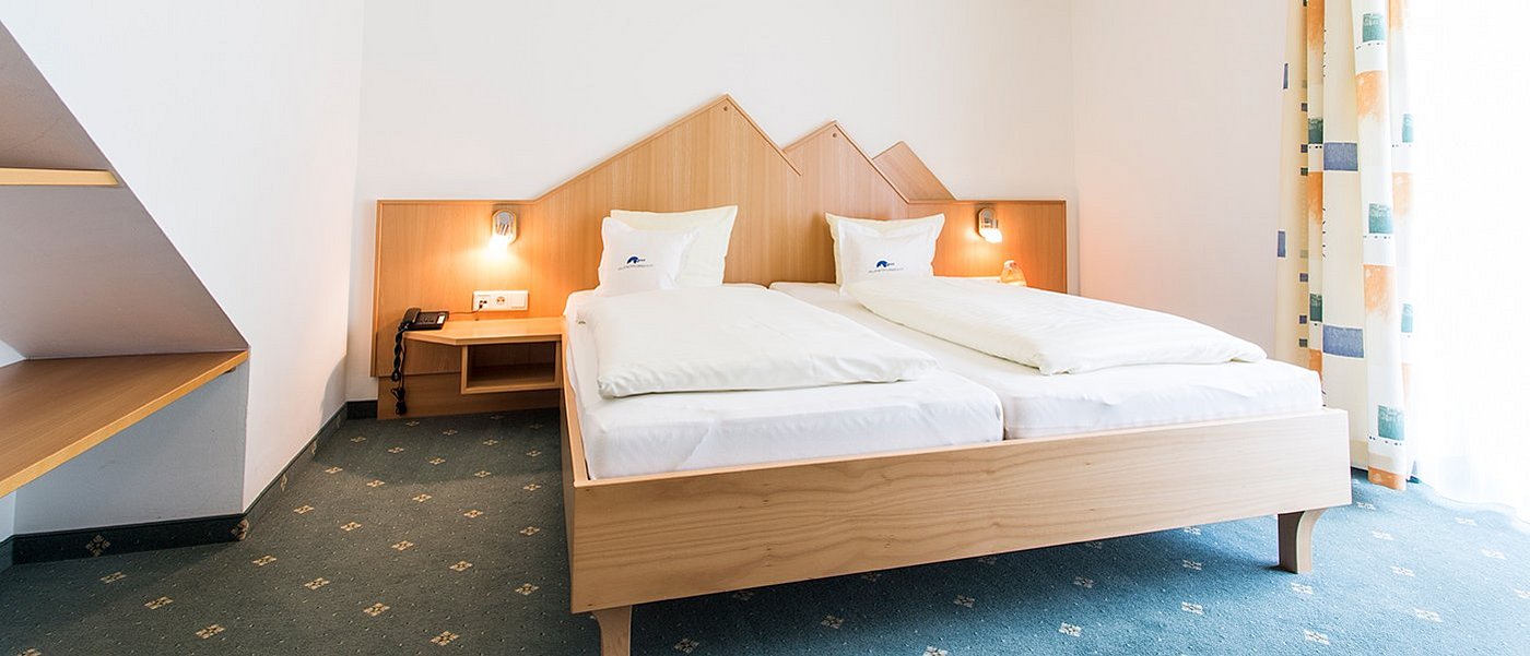 Hotel room with double bed.