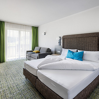 One bedroom with a large double bed.