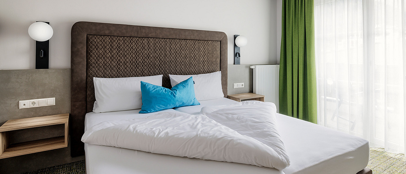 Large double bed in a flat.