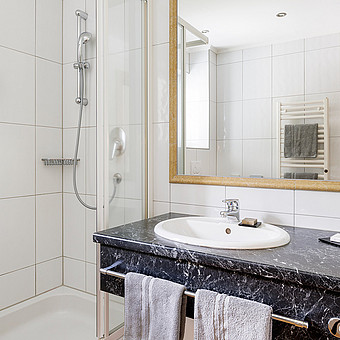 A bathroom with a shower.