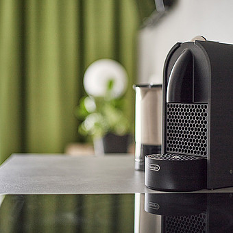 A coffee machine in a kitchen.