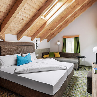 A small modern bedroom with a double bed.